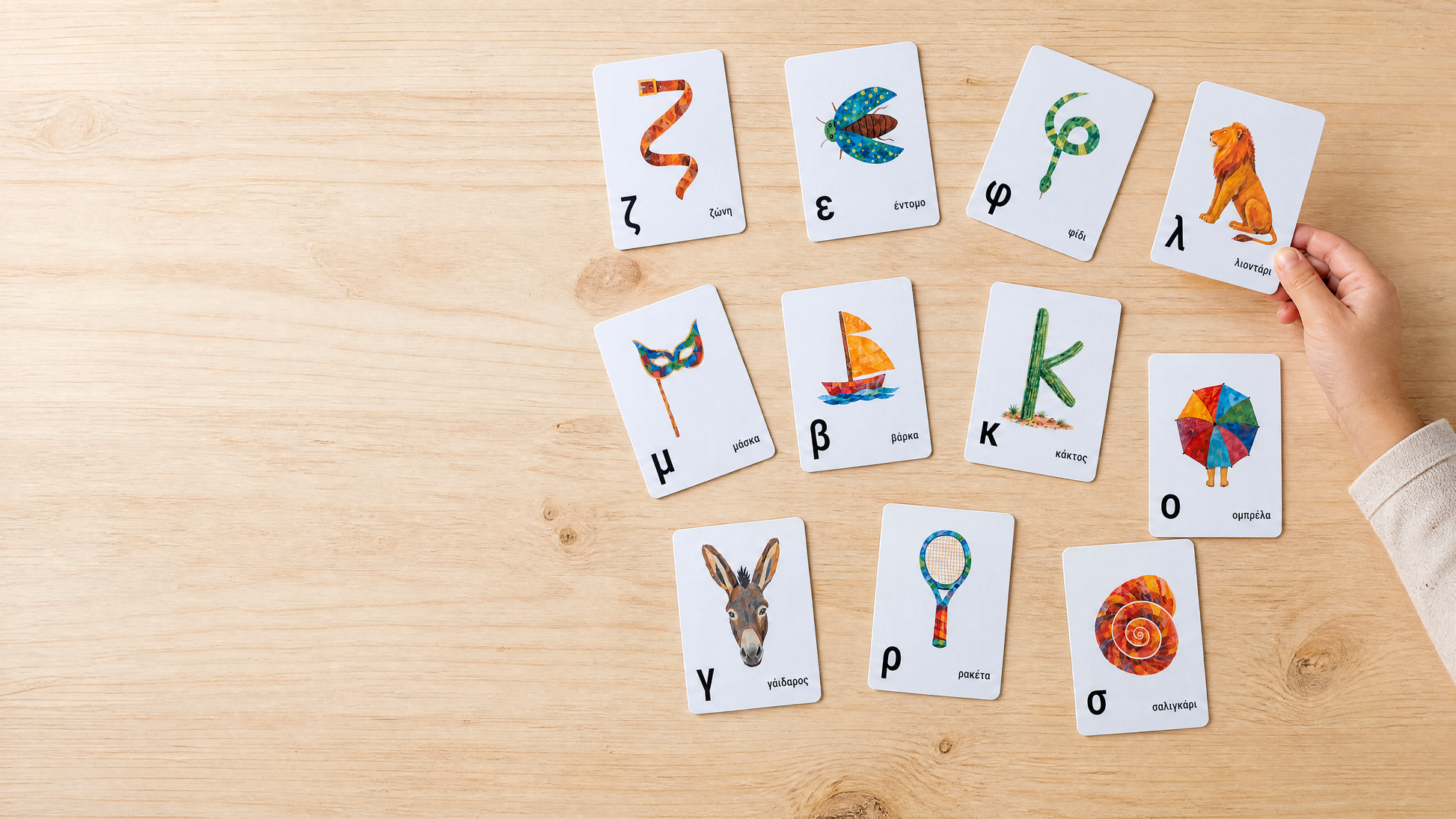 Greek alphabet cards spread across a table